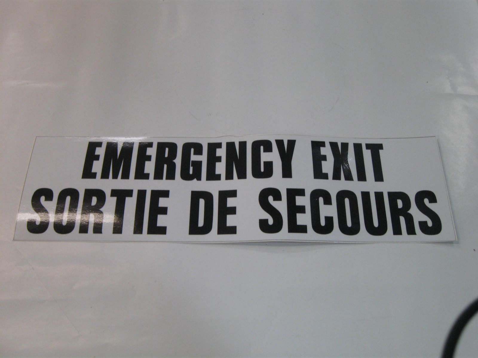 DECAL,EMER EXIT,BILING ,BLK/W